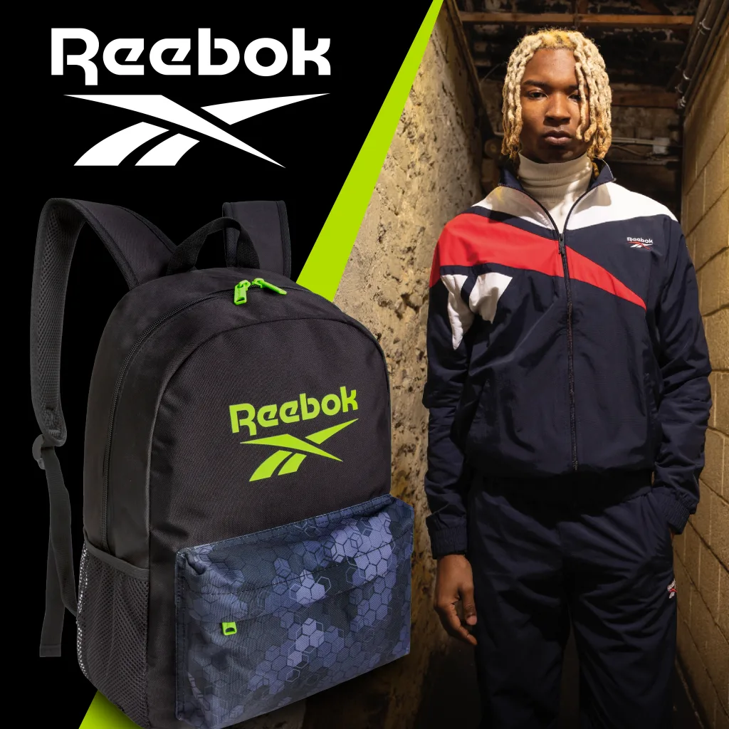 FCSI | A person with blonde hair wearing a navy and red Reebok tracksuit stands in a dimly lit hallway. To the left, there's a black Reebok backpack with a green logo and floral design. The Reebok logo is displayed above.